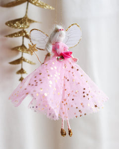 Decorative christmas fairy ornament with pink tulle skirt and gold accents on a white background