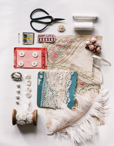 The florialice story. Haberdashery style photo with ribbons, scissors, vintage buttons, cotton reels, sequins, french lace, pins and needles, ostrich feather, embroidered silks, antique handmade flowers.