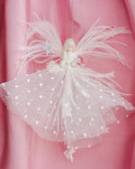 Load image into Gallery viewer, Decorative angel ornament with tulle skirt on a pink background
