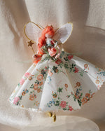 Load image into Gallery viewer, Decorative fairy figurine with floral dress and wand on a soft white background

