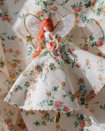 Load image into Gallery viewer, Decorative fairy figurine with floral dress on a floral background
