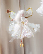 Load image into Gallery viewer, Florialice &#39;Snow Fairy&#39; dressed in a beautiful white dress with spots and stars, gold glittered wings and sparkly magic wand. Handmade fairy decoration that makes the perfect heirloom gift for Birthdays and Special Occasions.
