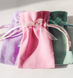 tooth fairy bags in pink, lilac, green with ribboon