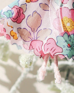 close up of liberty print pink fairy and glittered ballet slippers