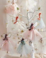 Load image into Gallery viewer, Decorative fairy figurines with tulle skirts on a string against a light background
