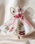 Load image into Gallery viewer, Decorative fairy figurine with pink ribbons and floral details on a soft background. inspired by the gowns of Bridgerton. Handmade heirloom gift.
