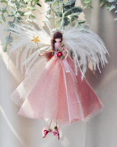 This handcrafted tree topper fairy is a truly one-of-a-kind treasure, carefully made by a skilled bridal designer using her finest fabrics. Each fairy is designed to be a keepsake, destined to become a cherished family heirloom.