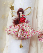 Load image into Gallery viewer, Made from the softest floral cotton and adorned with vintage fripperies. Valentine holds a magical golden wand and wears the sparkliest of wings. Vintage glass bead tiara sits upon her hair that catches the light and eyes of all onlookers 
